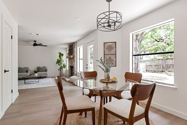 13265 Kerrville Folkway Dr, Austin, TX 78729 - dining area featuring wood finished floors, a chandelier, and ceiling fan