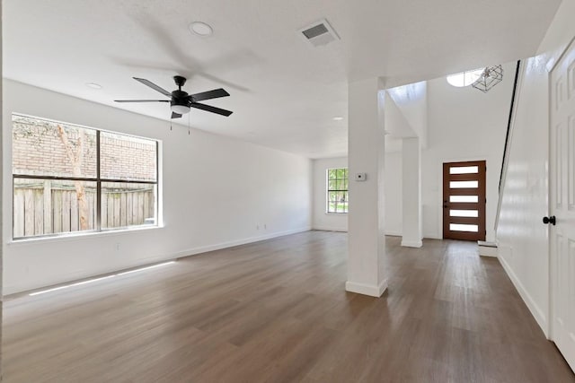 13265 Kerrville Folkway Dr, Austin, TX 78729 - unfurnished living room with a ceiling fan and wood finished floors
