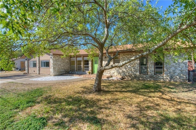 1811 Lone Oak Dr, Leander, TX 78641 - back of property featuring stone siding and a lawn