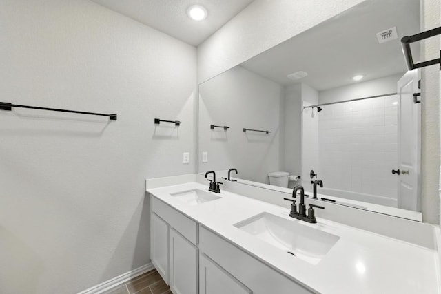 149 Hackberry Ln, Bastrop, TX 78602 - bathroom featuring double vanity, bathing tub / shower combination, recessed lighting, and wood finished floors