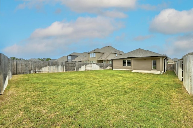 149 Hackberry Ln, Bastrop, TX 78602 - back of house featuring a patio and a fenced backyard