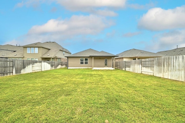 149 Hackberry Ln, Bastrop, TX 78602 - back of house with a fenced backyard and a patio area