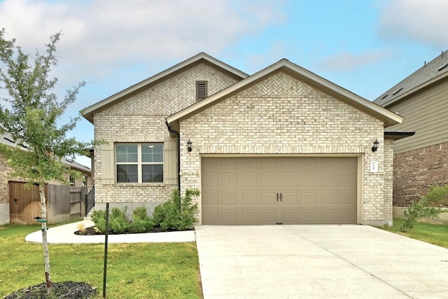 149 Hackberry Ln, Bastrop, TX 78602 - view of front of house with brick siding, an attached garage, concrete driveway, and a front lawn