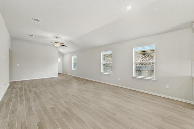 149 Hackberry Ln, Bastrop, TX 78602 - spare room featuring ceiling fan, light wood-style floors, and lofted ceiling