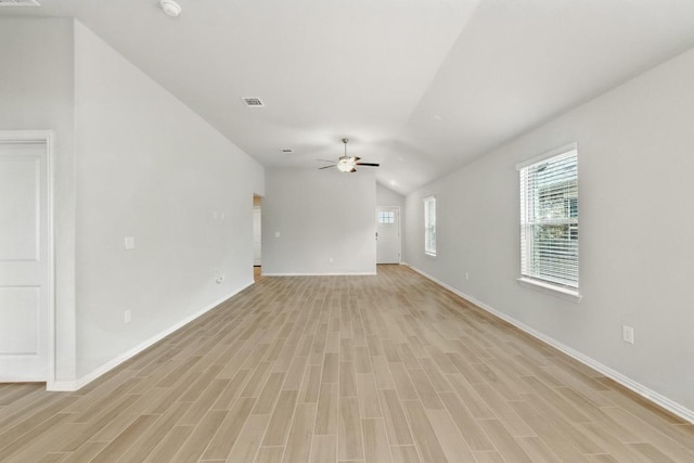 149 Hackberry Ln, Bastrop, TX 78602 - unfurnished living room featuring vaulted ceiling, light wood-type flooring, and a ceiling fan