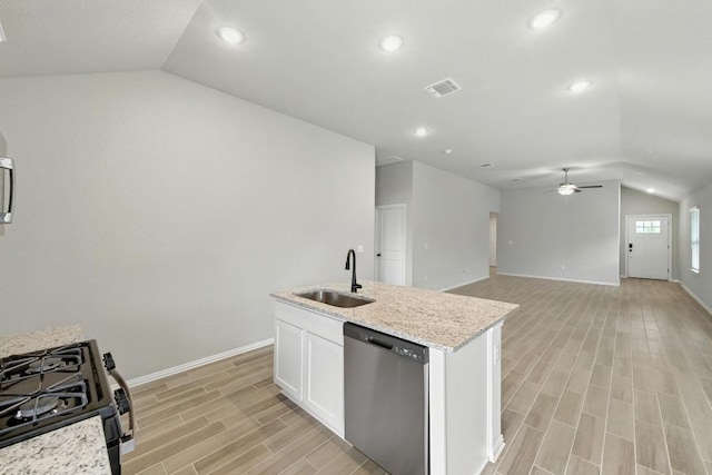 149 Hackberry Ln, Bastrop, TX 78602 - kitchen with dishwasher, vaulted ceiling, a ceiling fan, light wood finished floors, and white cabinetry
