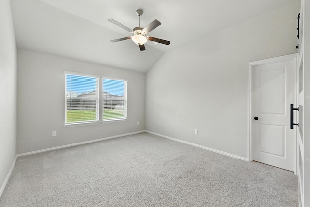149 Hackberry Ln, Bastrop, TX 78602 - unfurnished room featuring a ceiling fan, vaulted ceiling, and carpet flooring
