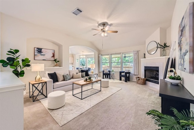 1108 Red Ranch Cir, Cedar Park, TX 78613 - living area with carpet flooring, ceiling fan, arched walkways, a fireplace, and vaulted ceiling