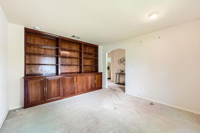 1108 Red Ranch Cir, Cedar Park, TX 78613 - unfurnished living room with arched walkways and light carpet