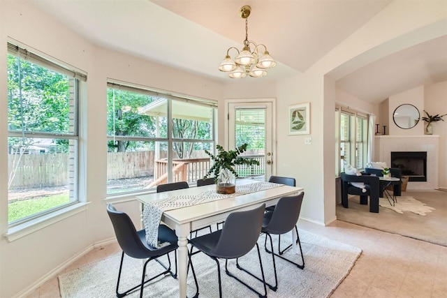 1108 Red Ranch Cir, Cedar Park, TX 78613 - dining space featuring plenty of natural light, lofted ceiling, a chandelier, and a fireplace