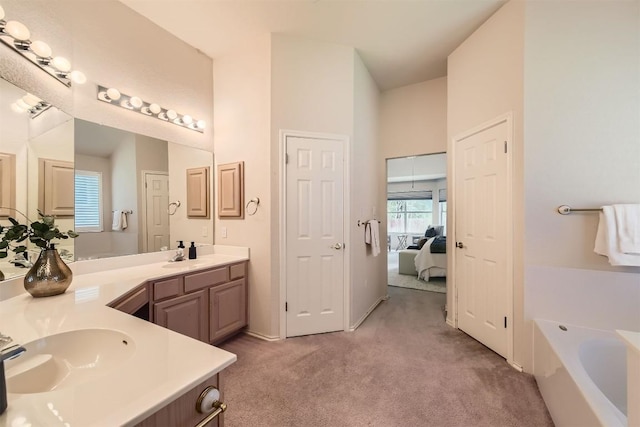 1108 Red Ranch Cir, Cedar Park, TX 78613 - full bathroom featuring double vanity, a garden tub, ensuite bathroom, and carpet