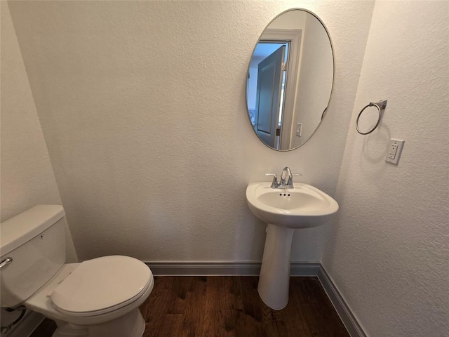 2105 Tiger Trl Unit 702, Round Rock, TX 78664 - bathroom featuring wood finished floors and toilet