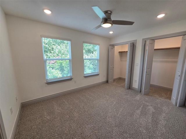 2105 Tiger Trl Unit 702, Round Rock, TX 78664 - unfurnished bedroom with multiple closets, carpet floors, recessed lighting, and a ceiling fan