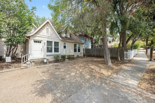 1110 W 22nd St Unit 1, Austin, TX 78705 - view of front of property with stucco siding and roof with shingles