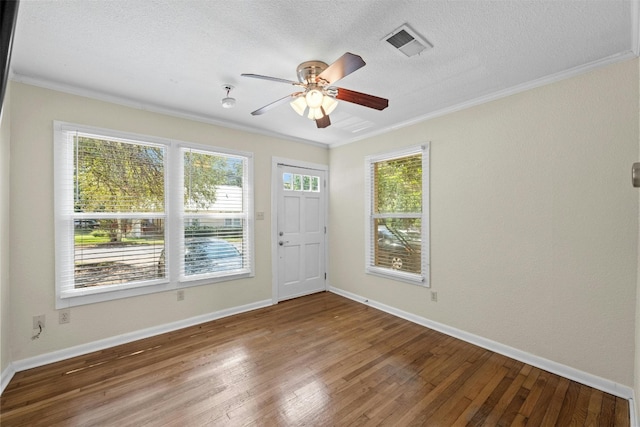 1110 W 22nd St Unit 1, Austin, TX 78705 - unfurnished room with crown molding, wood finished floors, ceiling fan, and a textured ceiling