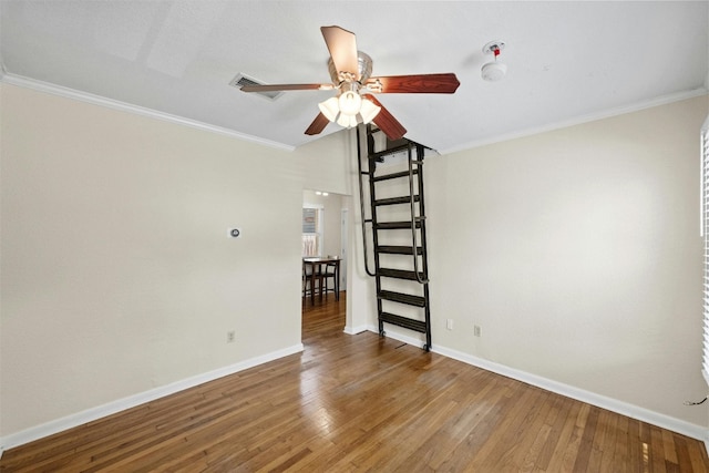 1110 W 22nd St Unit 1, Austin, TX 78705 - unfurnished room featuring a ceiling fan, wood finished floors, and ornamental molding