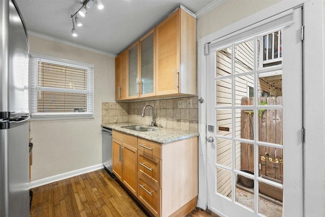 1110 W 22nd St Unit 1, Austin, TX 78705 - kitchen featuring stainless steel appliances, crown molding, dark wood-type flooring, decorative backsplash, and light stone counters