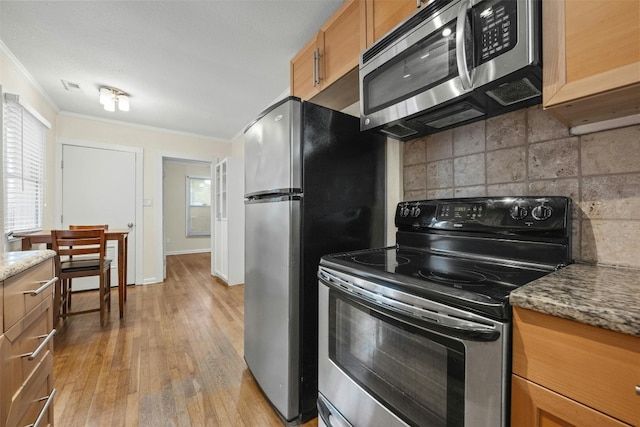 1110 W 22nd St Unit 1, Austin, TX 78705 - kitchen featuring stainless steel appliances, crown molding, tasteful backsplash, light wood-type flooring, and brown cabinetry