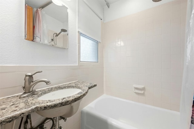 1110 W 22nd St Unit 1, Austin, TX 78705 - bathroom featuring shower / bath combination with curtain and tile walls