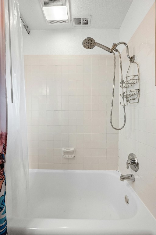 1110 W 22nd St Unit 1, Austin, TX 78705 - bathroom featuring shower / bath combo with shower curtain