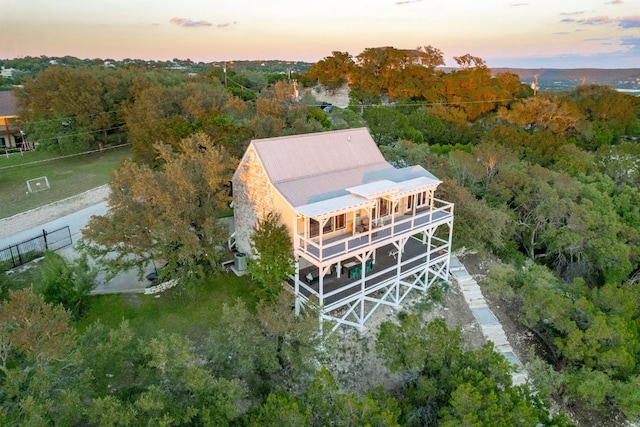 8132 Breeze Way, Jonestown, TX 78645 - aerial view at dusk of a wooded view