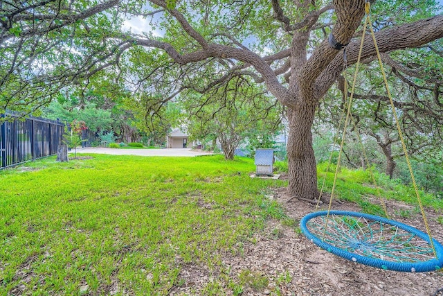 8132 Breeze Way, Jonestown, TX 78645 - view of yard featuring concrete driveway