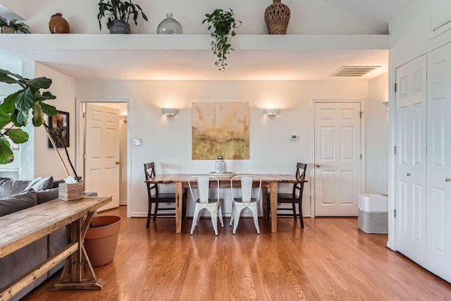 8132 Breeze Way, Jonestown, TX 78645 - dining space with wood finished floors