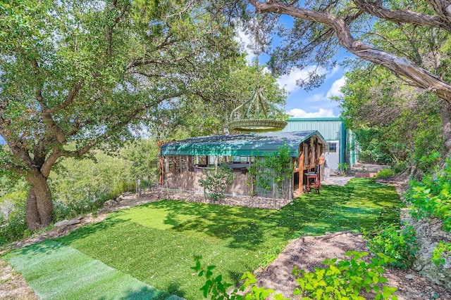 8132 Breeze Way, Jonestown, TX 78645 - view of green lawn with an outbuilding