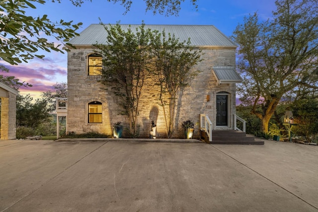 8132 Breeze Way, Jonestown, TX 78645 - french provincial home with stone siding and a metal roof