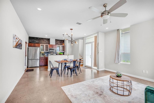 5325 Sendero Hills Pkwy, Austin, TX 78724 - dining area with recessed lighting, ceiling fan, and dark aggregate flooring