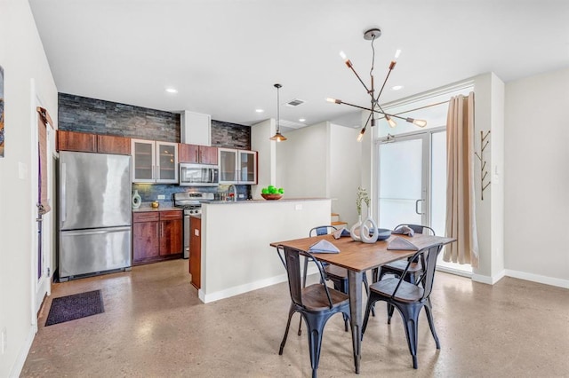 5325 Sendero Hills Pkwy, Austin, TX 78724 - dining room with a chandelier and recessed lighting