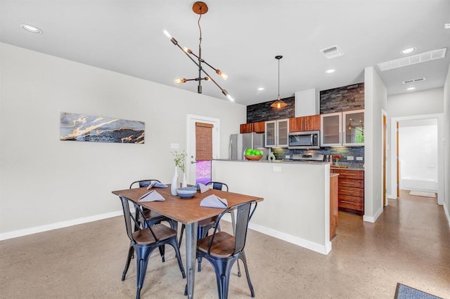 5325 Sendero Hills Pkwy, Austin, TX 78724 - dining room with recessed lighting and a chandelier