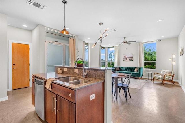 5325 Sendero Hills Pkwy, Austin, TX 78724 - kitchen with dishwasher, open floor plan, an island with sink, a ceiling fan, and hanging light fixtures