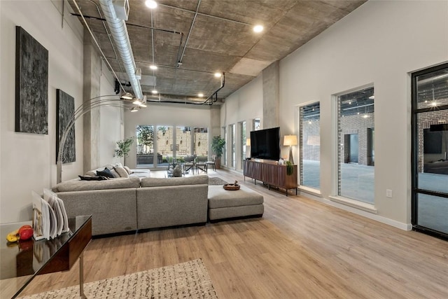 4510 Terry-O Ln Unit 126, Austin, TX 78745 - living room featuring wood finished floors and a towering ceiling
