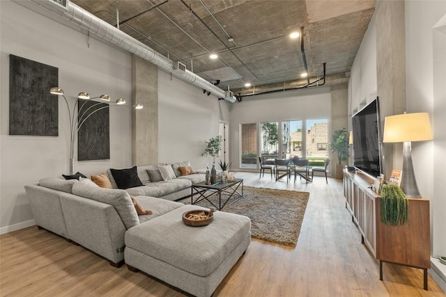 4510 Terry-O Ln Unit 126, Austin, TX 78745 - living area featuring a high ceiling and wood finished floors
