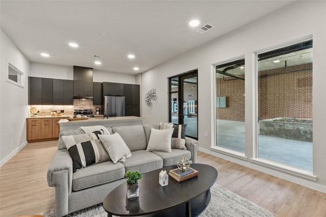 4510 Terry-O Ln Unit 126, Austin, TX 78745 - living room with light wood-type flooring and recessed lighting