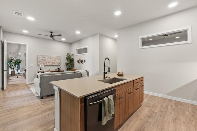 4510 Terry-O Ln Unit 126, Austin, TX 78745 - kitchen featuring dishwasher, light wood-style floors, recessed lighting, a ceiling fan, and a kitchen island with sink