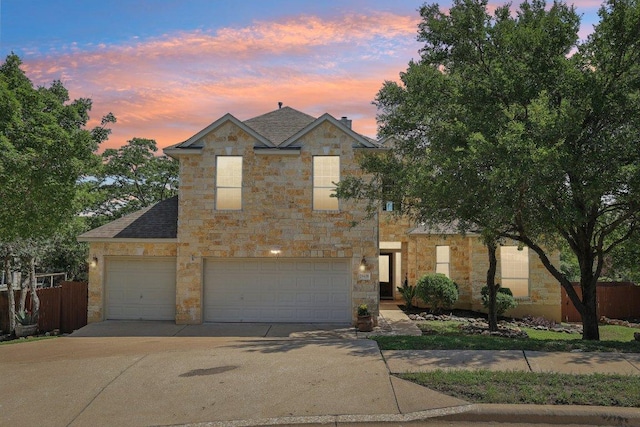 11421 Dona Villa Dr, Austin, TX 78726 - traditional home with stone siding, driveway, and a garage