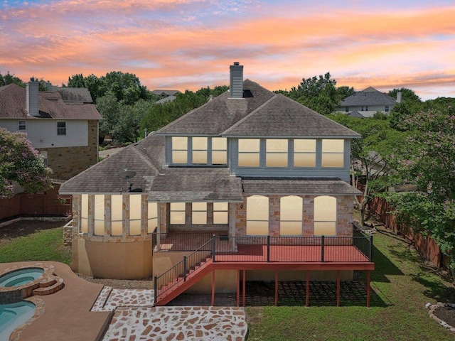 11421 Dona Villa Dr, Austin, TX 78726 - back of house at dusk featuring a deck, roof with shingles, stairs, a chimney, and a patio area