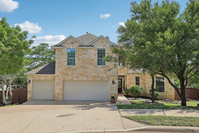 11421 Dona Villa Dr, Austin, TX 78726 - traditional-style home featuring concrete driveway, stone siding, a garage, and roof with shingles