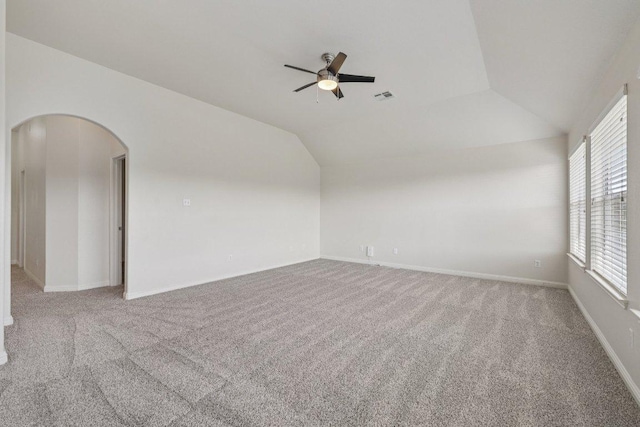 11421 Dona Villa Dr, Austin, TX 78726 - carpeted spare room featuring ceiling fan, vaulted ceiling, and arched walkways