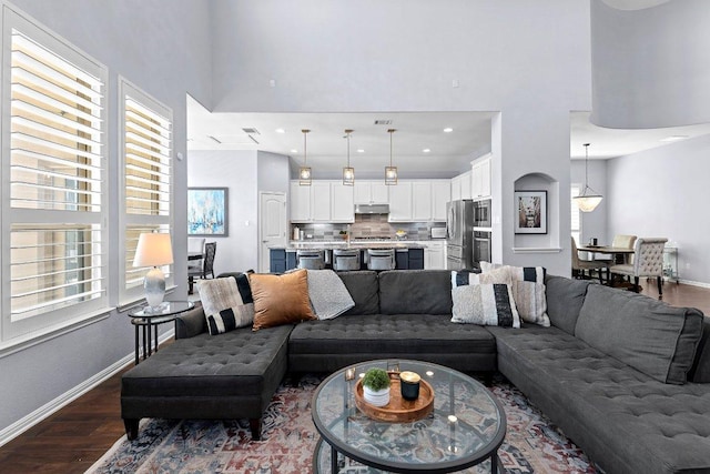 1702 Ambling Trl, Cedar Park, TX 78613 - living room featuring dark wood finished floors and a towering ceiling
