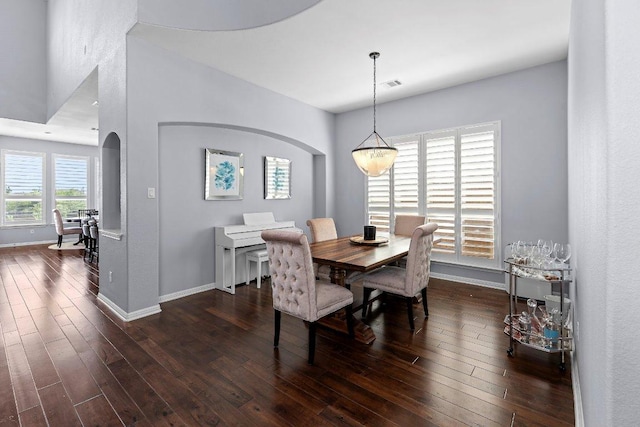 1702 Ambling Trl, Cedar Park, TX 78613 - dining area featuring arched walkways and dark wood-style floors