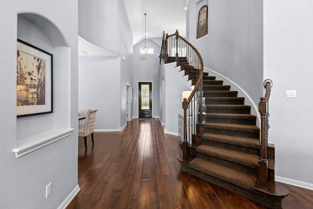 1702 Ambling Trl, Cedar Park, TX 78613 - entrance foyer featuring stairway, wood-type flooring, and a towering ceiling
