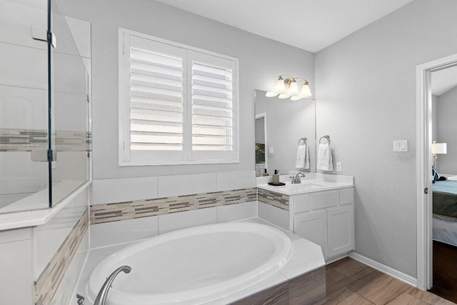 1702 Ambling Trl, Cedar Park, TX 78613 - bathroom with ensuite bathroom, a bath, and vanity