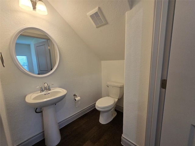 2105 Tiger Trl Unit 701, Round Rock, TX 78664 - bathroom featuring wood finished floors and lofted ceiling