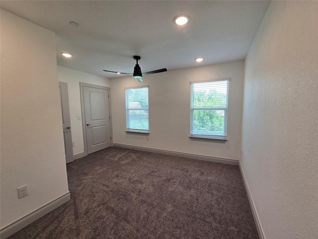 2105 Tiger Trl Unit 701, Round Rock, TX 78664 - unfurnished room with dark carpet, ceiling fan, and recessed lighting