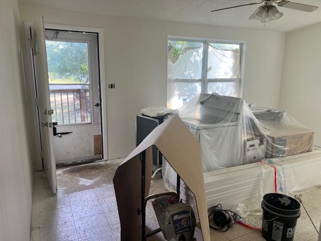 908 Glass Dr, Leander, TX 78641 - miscellaneous room with plenty of natural light, ceiling fan, and tile patterned floors