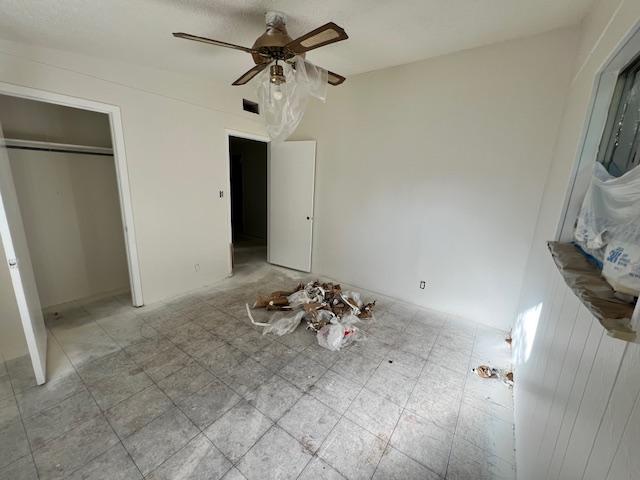 908 Glass Dr, Leander, TX 78641 - unfurnished bedroom featuring a ceiling fan and a closet