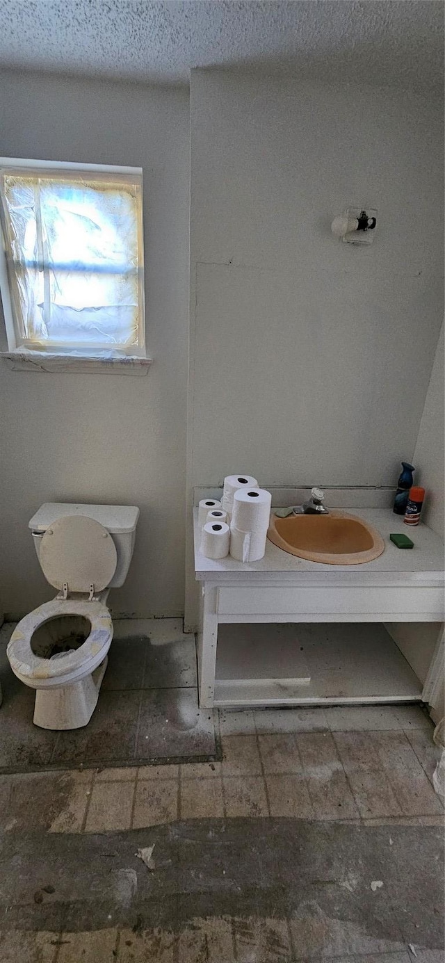 908 Glass Dr, Leander, TX 78641 - bathroom with toilet and a sink